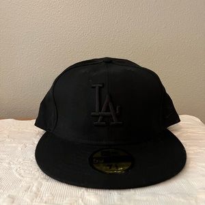 Genuine Merchandise New Era black LA Baseball cap. Brand new. Never worn.